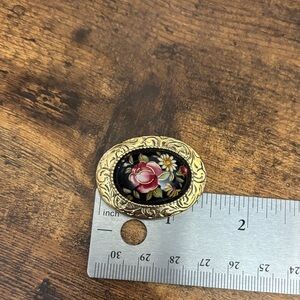 1928 Gold and Black Floral Brooch